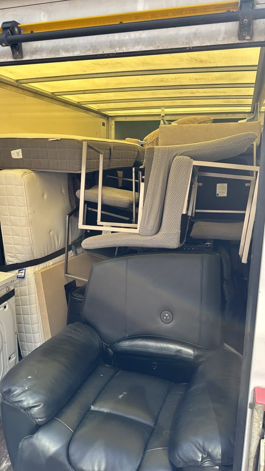 Leather sofa wrapped and loaded into a RayMovals van for furniture transport